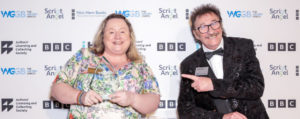 Emma Reeves (Best Children's TV Episode winner) with presenter Paul Chuckle